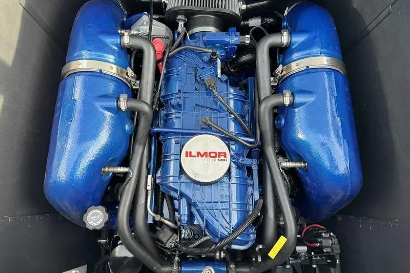 Slide: The Image of 2023 MasterCraft XT22 Ilmor engine, blue components, powerful marine performance. - 13