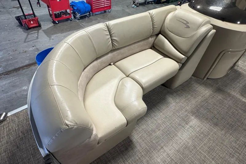 Slide: The Image of 2014 Bennington 2275 GL boat interior with beige leather seating. - 2