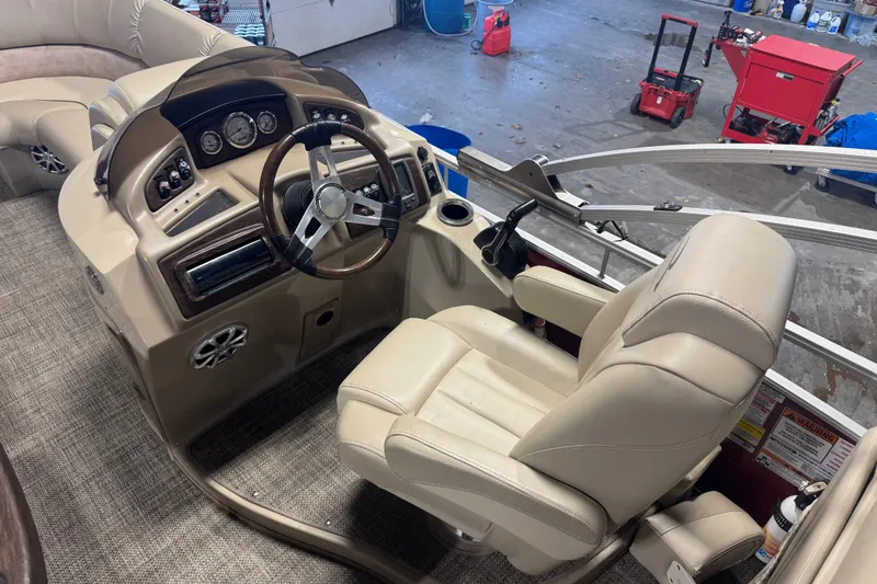 Slide: The Image of 2014 Bennington 2275 GL boat interior with steering wheel and control panel. - 5