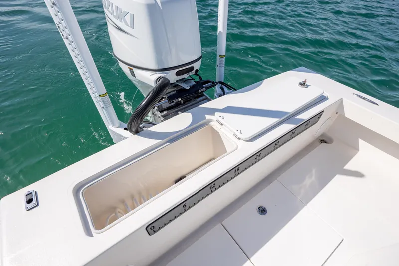 Slide: The Image of 2024 Layton Bay 22 boat with Suzuki engine, featuring a built-in measuring ruler. - 10
