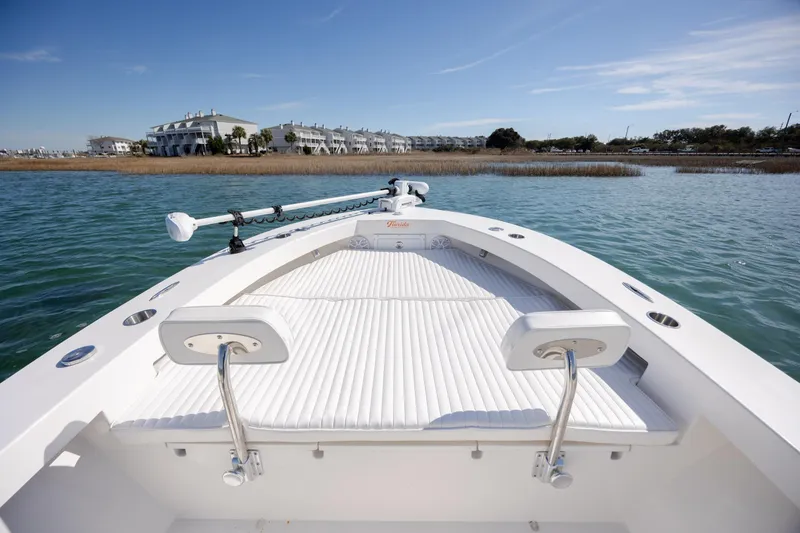 Slide: The Image of 2024 Layton Bay 22 boat on water, featuring spacious deck and modern design. - 18