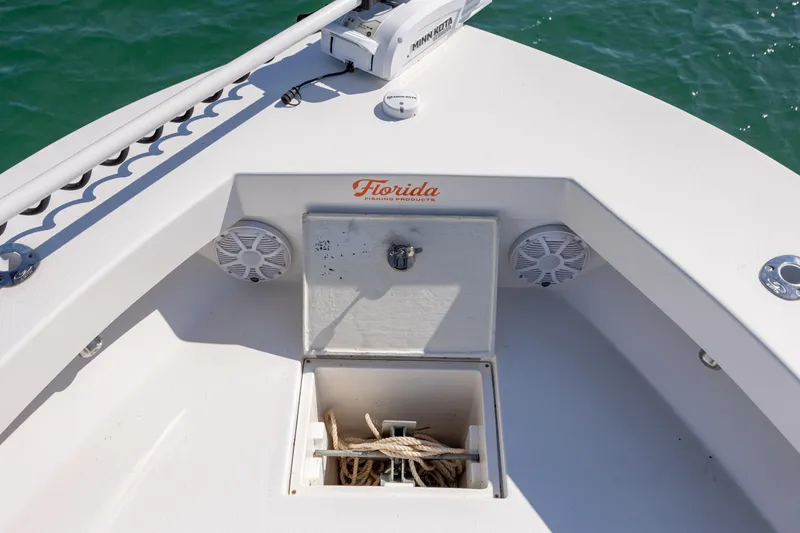 Slide: The Image of 2024 Layton Bay 22 boat deck with storage compartment and speakers. - 21