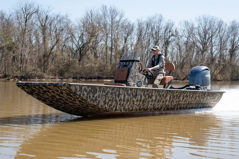 Slide: The Image of Manufacturer Provided Image: Avid 22 Rogue CC 2026 boat on a calm river. - 12