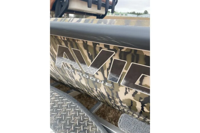 Slide: The Image of 2026 Avid 22 Rogue CC boat with camouflage design and metallic logo. - 4