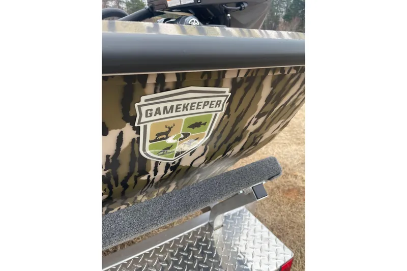 Slide: The Image of Camouflage-patterned 2026 Avid 22 Rogue CC boat with Gamekeeper logo on the side. - 5