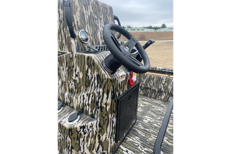 Slide: The Image of Camouflage interior of 2026 Avid 22 Rogue CC boat with steering wheel. - 6
