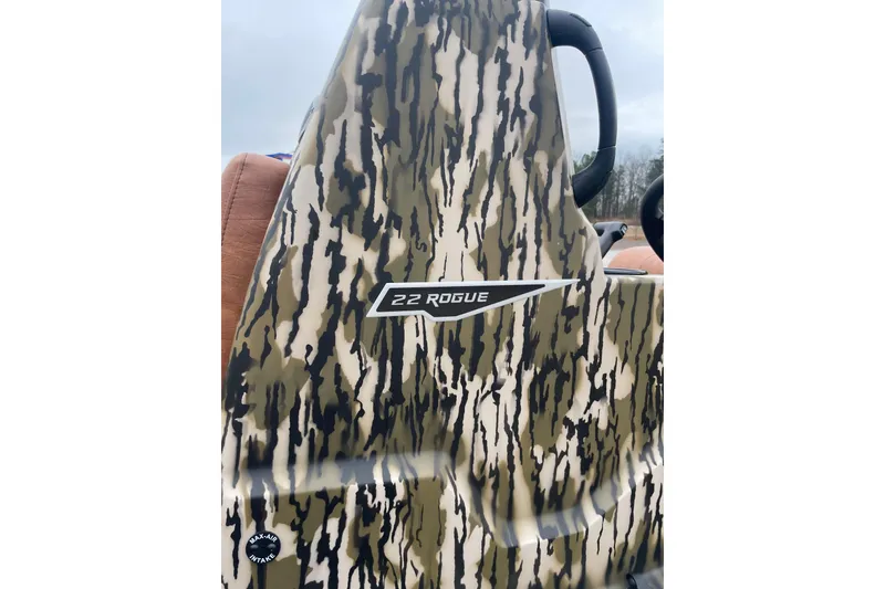 Slide: The Image of Camouflage-patterned Avid 22 Rogue CC boat, 2026 model, with visible branding. - 9