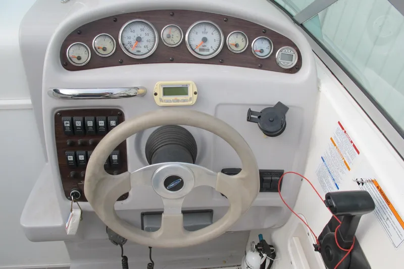 Slide: The Image of 2006 Chaparral Signature 240 dashboard with steering wheel and instrument panel. - 10