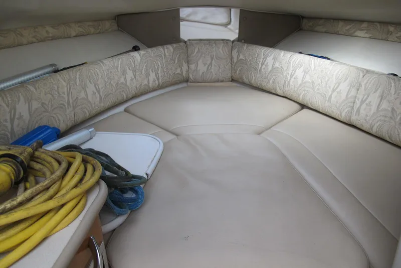 Slide: The Image of 2006 Chaparral Signature 240 cabin interior with seating and storage items. - 11