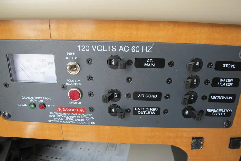 Slide: The Image of Electrical control panel of a 2006 Chaparral Signature 240 boat, showing various switches and indicators. - 15