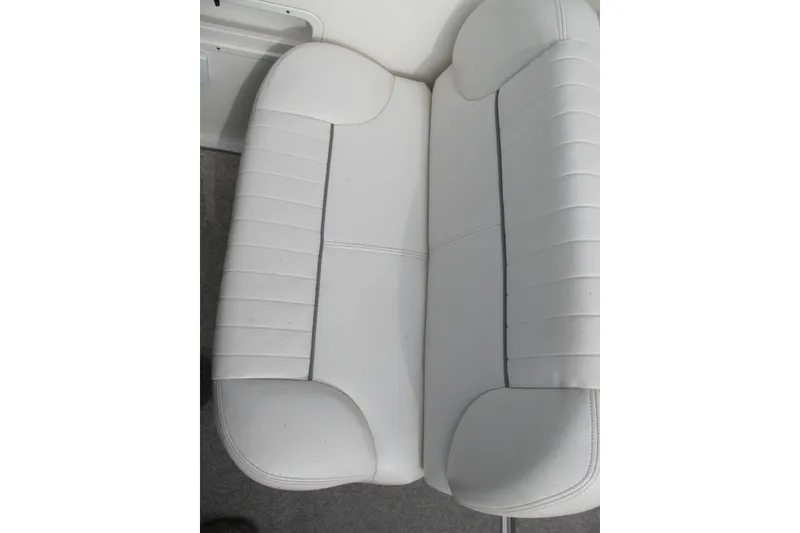 Slide: The Image of White leather seating on 2006 Chaparral Signature 240 boat, showcasing elegant design. - 7
