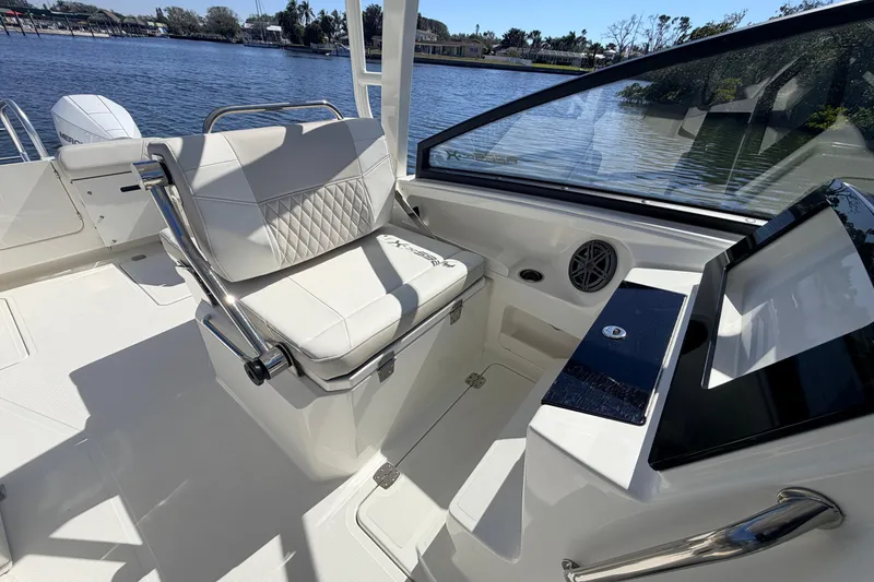 Slide: The Image of 2026 World Cat 265 DC-X boat interior with luxurious seating and modern dashboard. - 14