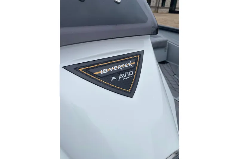 Slide: The Image of Avid 18 Vertex 2026 boat badge on white surface, showcasing brand and model. - 8