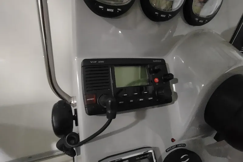 Slide: The Image of Control panel of a 2015 Boston Whaler 285 Conquest with Garmin VHF 200 radio. - 17