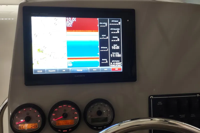 Slide: The Image of Dashboard of a 2015 Boston Whaler 285 Conquest with Garmin navigation display. - 23