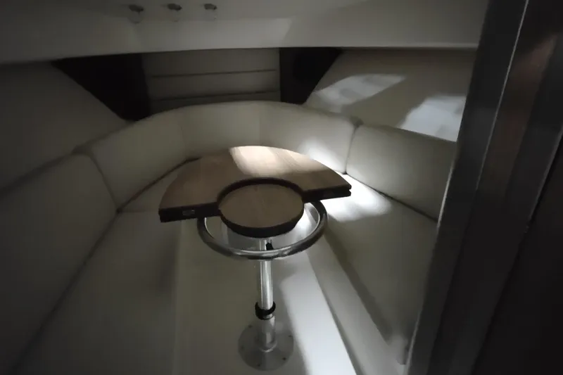 Slide: The Image of Interior cabin of 2015 Boston Whaler 285 Conquest with seating and table. - 42