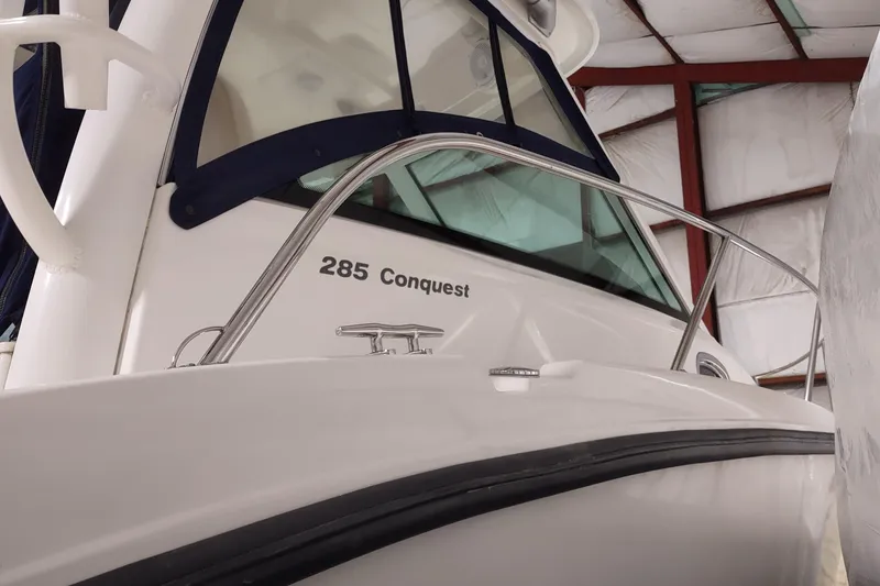 Slide: The Image of 2015 Boston Whaler 285 Conquest boat in storage, showcasing sleek design and sturdy build. - 48