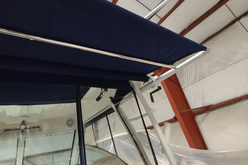 Slide: The Image of 2015 Boston Whaler 285 Conquest boat canopy detail in storage facility. - 5
