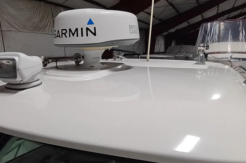 Slide: The Image of 2015 Boston Whaler 285 Conquest with Garmin xHD radar in a storage facility. - 50