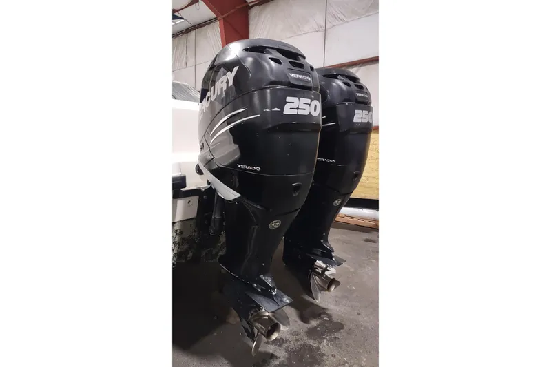 Slide: The Image of Twin Mercury 250 Verado outboard engines on a 2015 Boston Whaler 285 Conquest. - 52