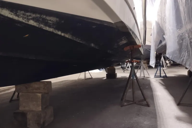 Slide: The Image of 2015 Boston Whaler 285 Conquest boat on stands in a storage facility. - 55