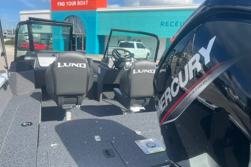 Slide: The Image of 2026 Lund 1650 Rebel XL Sport boat with Mercury engine at dealership. - 7