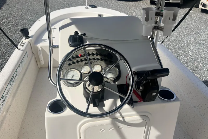 Slide: The Image of 2019 Carolina Skiff 18 JVX SS boat console with steering wheel and gauges. - 6