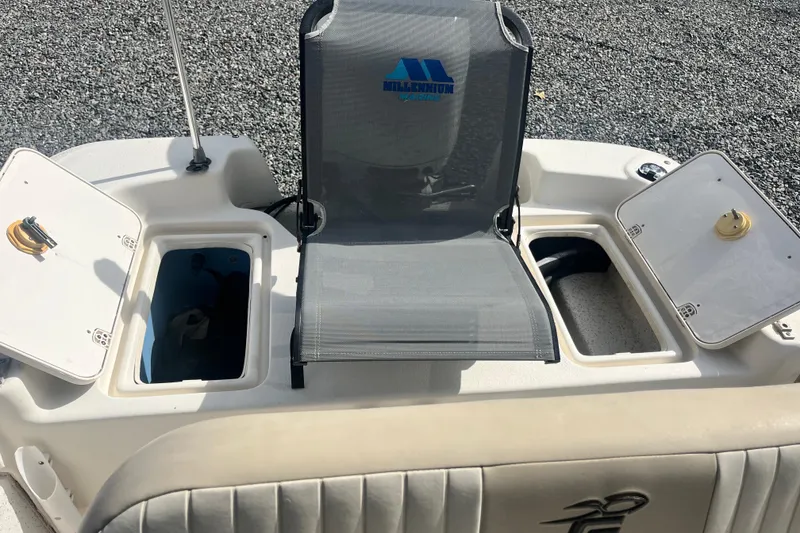 Slide: The Image of 2019 Carolina Skiff 18 JVX SS boat interior with storage compartments and seating. - 8
