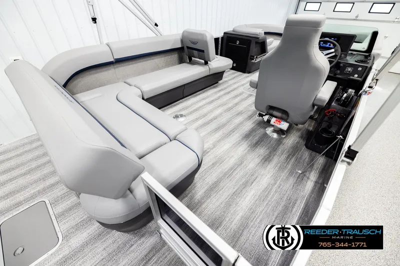 Slide: The Image of 2026 Bennington MLSF boat interior with gray seating and modern dashboard. - 12
