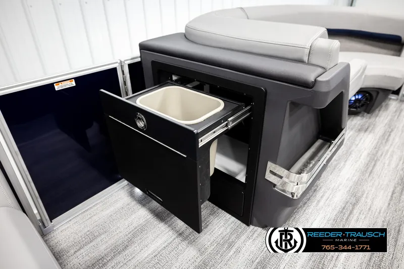 Slide: The Image of 2026 Bennington MLSF boat interior with pull-out storage compartment and seating. - 21