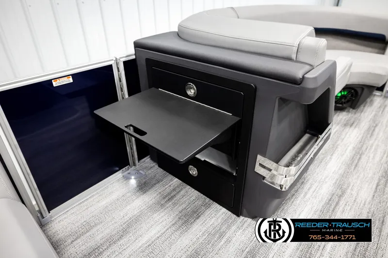 Slide: The Image of 2026 Bennington MLSF boat interior with storage compartment and seating. - 22