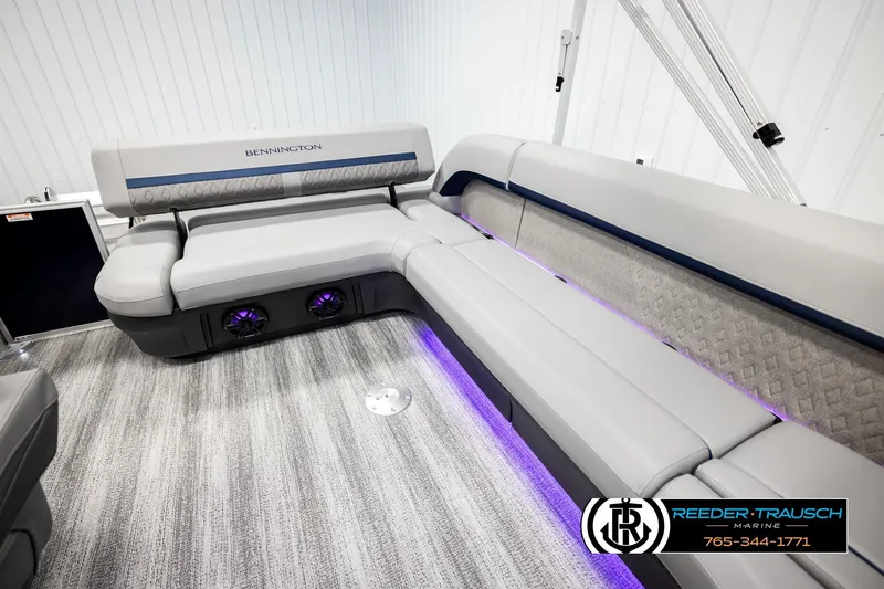 Slide: The Image of 2026 Bennington MLSF boat interior with luxurious seating and ambient lighting. - 26