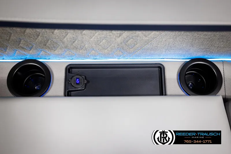 Slide: The Image of Interior of 2026 Bennington MLSF with cup holders and ambient lighting. - 44