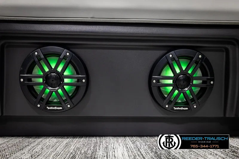 Slide: The Image of 2026 Bennington MLSF boat speakers with green LED lights, featuring Rockford Fosgate branding. - 46