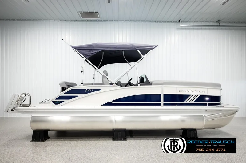 Slide: The Image of 2026 Bennington MLSF pontoon boat with canopy in showroom. - 5