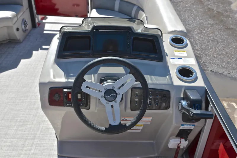 Slide: The Image of 2023 Silver Wave 2210 SW5 RLP boat dashboard with steering wheel and controls. - 26