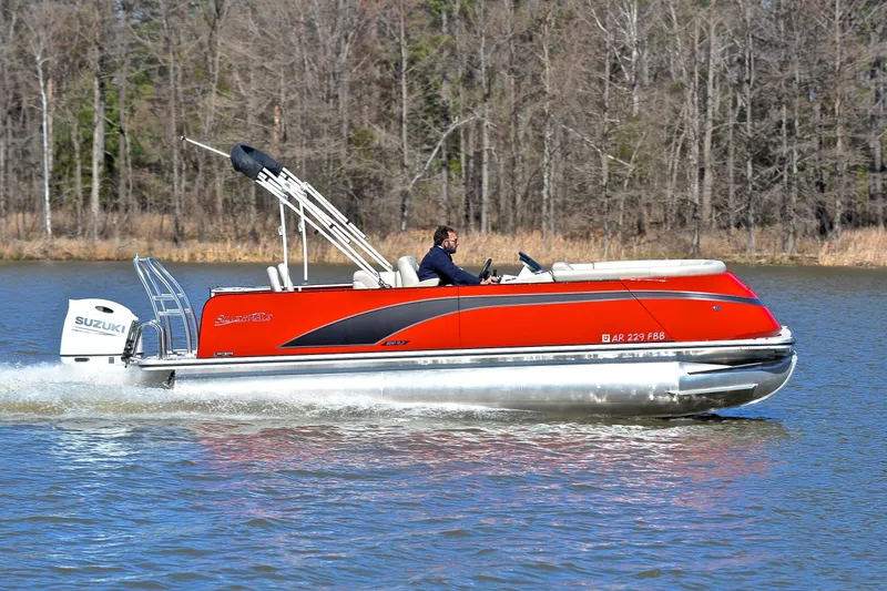 Slide: The Image of 2023 Silver Wave 2210 SW5 RLP pontoon boat cruising on a lake. - 3