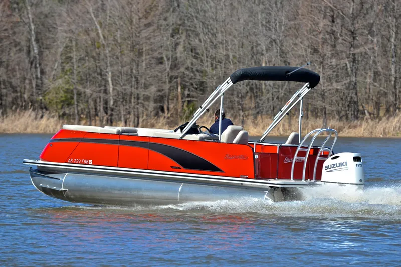 Slide: The Image of 2023 Silver Wave 2210 SW5 RLP pontoon boat cruising on a lake with Suzuki engine. - 4