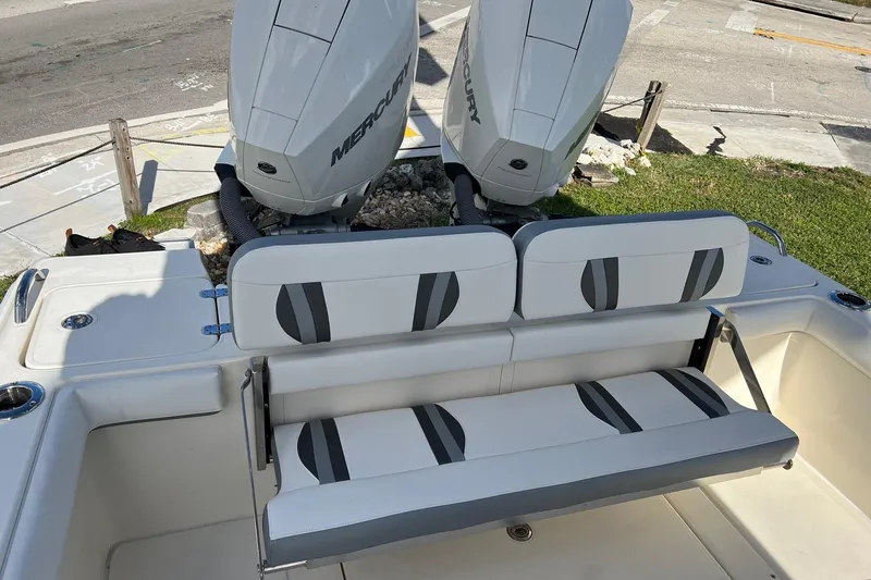 Slide: The Image of 2023 ShearWater 270 SS Carolina boat with dual Mercury engines and cushioned seating. - 6