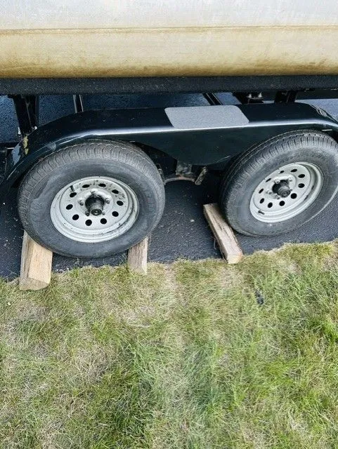 Slide: The Image of 2014 JC MFG SPIRIT 223TT FISH trailer tires on wooden blocks. - 11