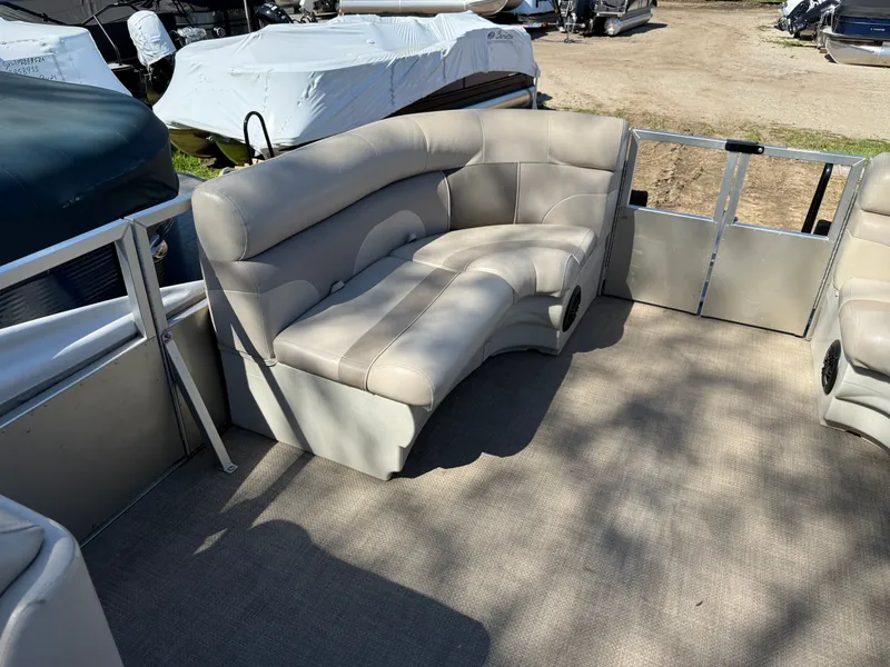 Slide: The Image of Interior of a 2014 JC MFG SPIRIT 223TT FISH boat with beige seating. - 14