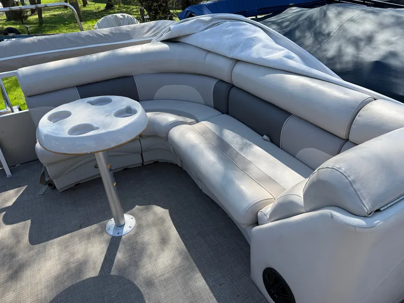 Slide: The Image of 2014 JC MFG SPIRIT 223TT FISH pontoon boat with seating area and table. - 16