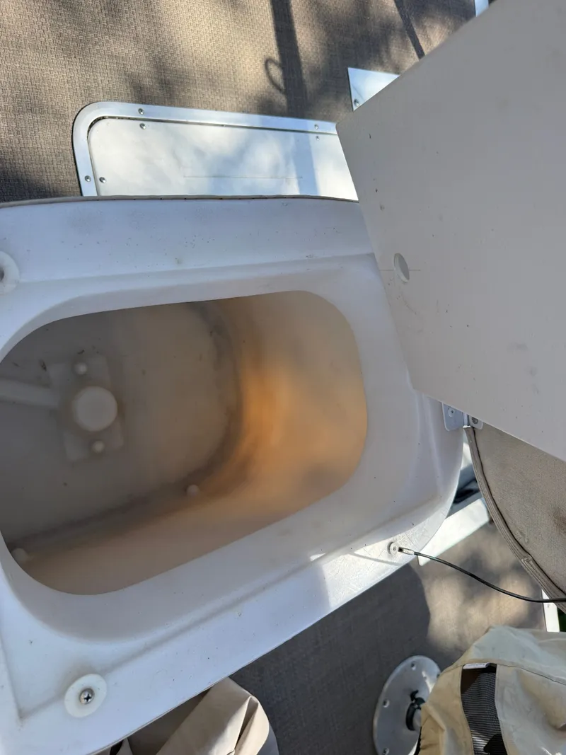 Slide: The Image of Open storage compartment on a 2014 JC MFG SPIRIT 223TT FISH boat. - 25