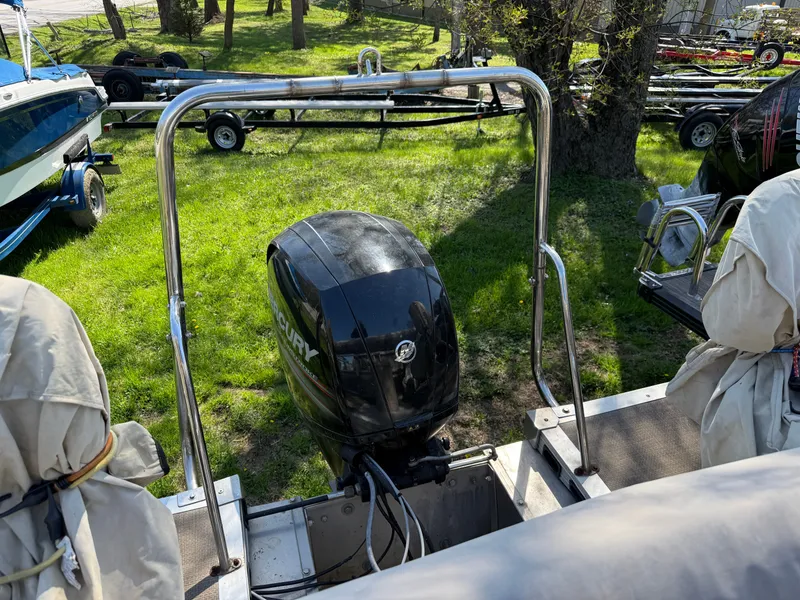 Slide: The Image of 2014 JC MFG SPIRIT 223TT FISH with Mercury engine on grass. - 26