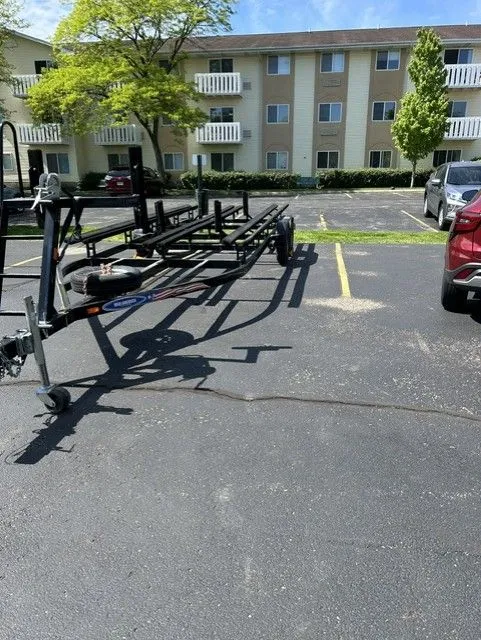 Slide: The Image of Boat trailer outdoors in parking lot, JC MFG SPIRIT 223TT FISH 2014. - 6