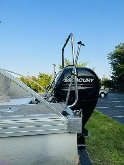 Slide: The Image of 2014 JC MFG SPIRIT 223TT FISH with Mercury engine outdoors. - 9