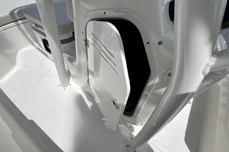Slide: The Image of Interior view of a Boston Whaler 190 Montauk with an open storage compartment door. - 16
