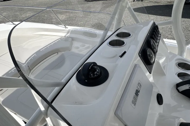 Slide: The Image of The image shows the cockpit of a Boston Whaler 190 Montauk with a helm console and compass. - 17