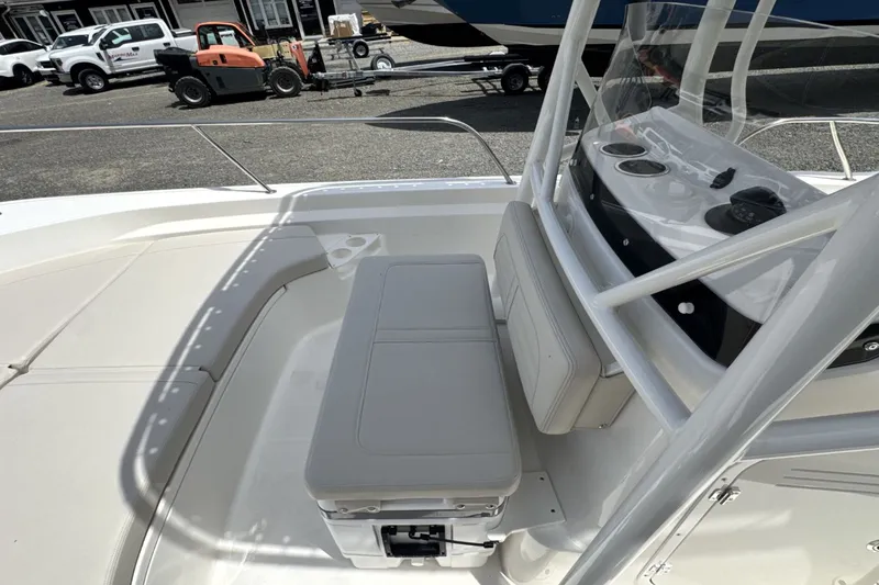 Slide: The Image of Boston Whaler 190 Montauk 2026: Spacious deck with bench seating and helm console. - 18
