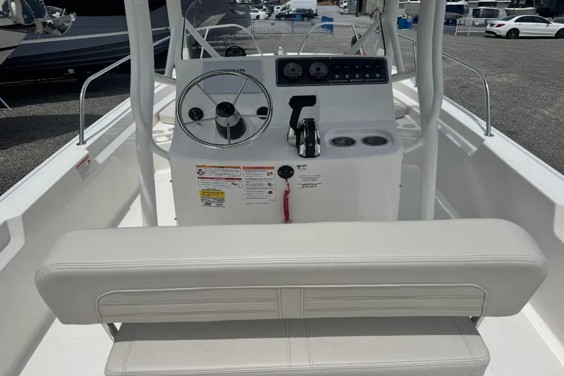 Slide: The Image of The image shows the cockpit of a 2026 Boston Whaler 190 Montauk with a helm and seating. - 3